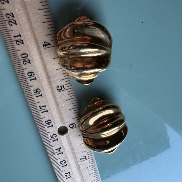 Large gold tone clip on vintage earrings